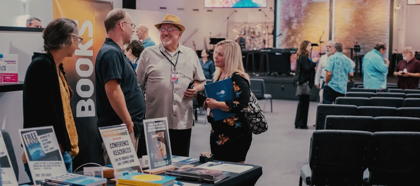Ministry leaders talking at the 2024 Free Grace Alliance conference